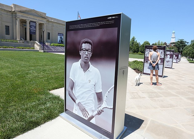Photos of Richmond tennis star Arthur Ashe Jr. during his 1968 victory at the U.S. Open line the front sidewalk of the Virginia Museum of History & Culture at 428 N. Arthur Ashe Blvd. The installation, featuring rarely seen images of Mr. Ashe by LIFE magazine photographer John Zimmerman, is part of the celebration and dedication of Arthur Ashe Boulevard and will be on view until July 7. The installation was produced for the 2018 U.S. Open commemoration of the 50th anniversary of Mr. Ashe’s historic win.