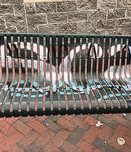 The spray-painted letters on this GRTC bench at 23rd and East Franklin streets prompted a reader’s complaint (see below) about graffiti marring seating for riders.