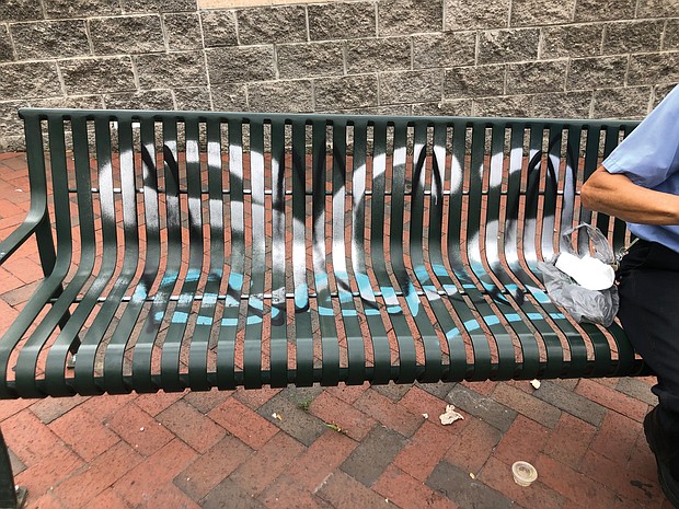 The spray-painted letters on this GRTC bench at 23rd and East Franklin streets prompted a reader’s complaint (see below) about graffiti marring seating for riders.