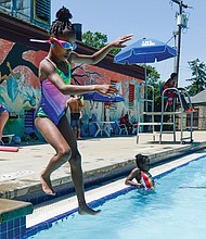 Pool's open!
Gianni Harris, 7, jumps into the Battery Park pool Saturday to enjoy the cool water with family and friends. The joyful noise and splashes of youngsters marked the official opening last weekend of the City of Richmond’s seven outdoor swimming pools. (Clement Britt/Richmond Free Press)