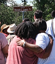 Honorary street sign for Fire Chief -Ronald C. Lewis/
Dozens of friends, neighbors, firefighters and supporters turned out for the sign’s unveiling last Saturday at the intersection of Birdwood and Bathgate roads in South Side’s Brookbury neighborhood, where the Lewis family lives. The trailblazing Chief Lewis was Richmond’s first African-American fire chief, serving in the top position from 1978 to 1995. (Sandra Sellars/Richmond Free Press)