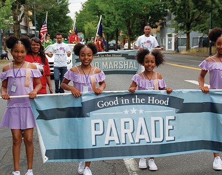 Carrying the banner for the Good in the Hood parade.