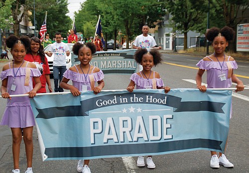 Carrying the banner for the Good in the Hood parade.
