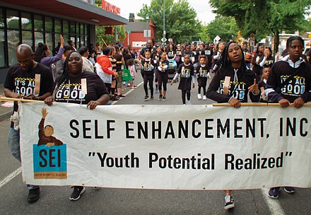 Students from Self Enhancement, Inc. march in Saturday’s parade.