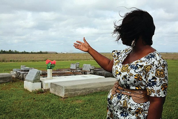 Above, Carolyn Smith, a descendant of the enslaved people sold by Georgetown University, shows gravesites of descendants who wound up in Houma, La. Behind her are the sugar mill and plantations where many of her ancestors worked. At left, Frank Campbell is shown in the only known photo of one of the people enslaved and sold by Georgetown’s Jesuit priests.