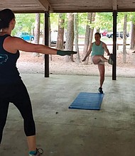 Stephanie Walton, foreground, leads a Females in Action workout in Apex, N.C.