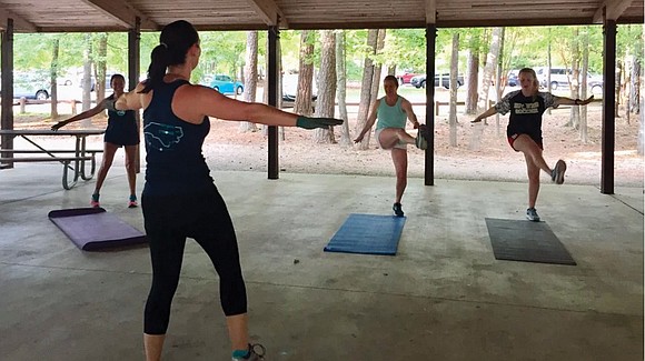 On a Tuesday evening under the roof of a public picnic shelter, a group of women ages 20 to 55 ...