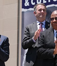 From left, Jamie O. Bosket, president and chief exeuctive officer of the Virginia Museum of History & Culture; Gov. Ralph S. Northam; and the Rev. Grady W. Powell, retired pastor of Gillfield Baptist Church of Petersburg and a member of the museum’s board, applaud during the ceremony.(Sandra Sellars/Richmond Free Press)