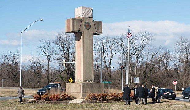 Visitors earlier this year walk around the 40-foot Maryland Peace Cross dedicated to World War I soldiers in Bladensburg, Md.