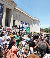 Hundreds of people took photos, including selfies, with the new street signs. (Regina H. Boone/Richmond Free Press)