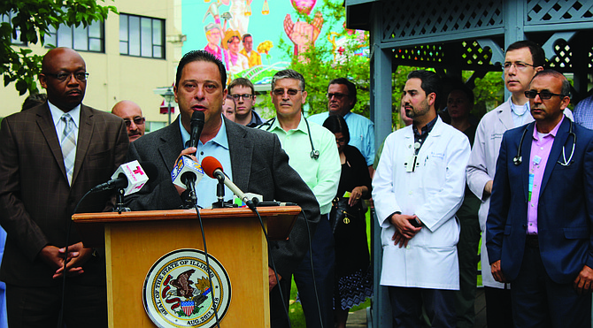 State Representative Robert Rita (pictured at podium) recently led a press conference alongside other Illinois lawmakers, south suburban residents and medical professionals to discuss the proposed closure of MetroSouth Medical Center. Photo Credit: Courtesy of State Representative Robert Rita