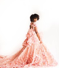 The model is wearing the “Haylee” design from the “Enchanted Botanicals” Collection