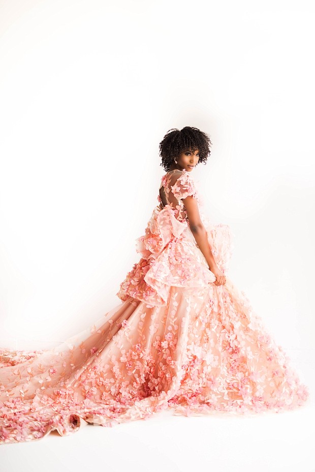 The model is wearing the “Haylee” design from the “Enchanted Botanicals” Collection