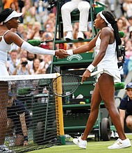 Cori Gauff, 15, receives a congratulatory handshake from her 39-year-old opponent Venus Williams after the teen beat the tennis champion 6-4, 6-4 Monday at Wimbledon. Gauff’s next match is Wednesday.