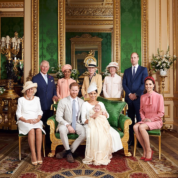 This official photograph from the christening of Archie, the son of Prince Harry and Meghan Markle, shows the baby’s family in the Green Drawing Room at Windsor Castle near London where the christening was held last Saturday. The proud parents, seated center, Prince Harry and Ms. Markle, the Duke and Duchess of Sussex, show off baby Archie in his christening robe. With them are, from left, Prince Harry’s stepmother, Camilla, the Duchess of Cornwall; Prince Harry’s father, Prince Charles; Ms. Markle’s mother, Doria Ragland; Prince Harry’s aunts, Lady Jane Fellowes and Lady Sarah McCorquodale; Prince Harry’s brother and sister-in-law, Prince William and Kate, the Duke and Duchess of Cambridge.