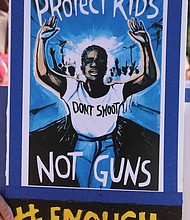 A sign held at Tuesday’s rally at the State Capitol.