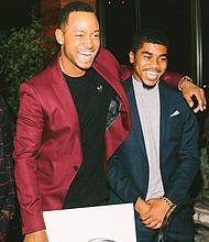 Jaelon Hodges, right, receives congratulations from actor Terrence Jenkins after learning he was chosen for a $15,000 scholarship for a summer internship with the former BET host of “106 & Park” in Los Angeles.