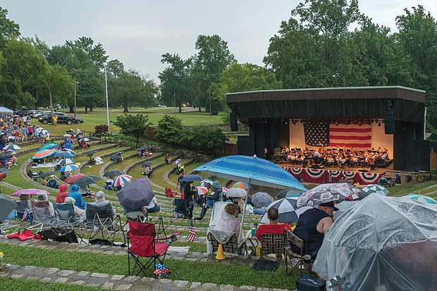 Fourth of July fans
Rain couldn’t dampen the Fourth of July holiday spirit of spectators who donned rain gear and huddled under umbrellas to hear the Richmond Concert Band perform at Richmond’s Dogwood Dell. The annual performance ushered in a fireworks show despite stormy weather last Thursday that canceled other area events.(photo by Ava Reaves)