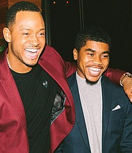 Jaelon Hodges, right, receives congratulations from actor Terrence Jenkins after learning he was chosen for a $15,000 scholarship for a summer internship with the former BET host of “106 & Park” in Los Angeles.