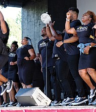 Members of Richmond’s In His Presence Conference Choir lift the spirits of hundreds of people attending the 10th Annual Gospel Music Festival on Sunday at Dogwood Dell. The free event was hosted by Sheilah Belle and Praise 104.7 FM as part of the City of Richmond’s Festival of Arts. (Sandra Sellars/Richmond Free Press)