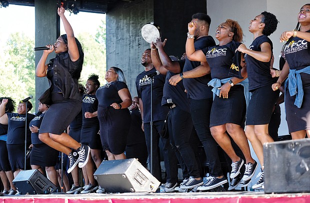 Members of Richmond’s In His Presence Conference Choir lift the spirits of hundreds of people attending the 10th Annual Gospel Music Festival on Sunday at Dogwood Dell. The free event was hosted by Sheilah Belle and Praise 104.7 FM as part of the City of Richmond’s Festival of Arts. (Sandra Sellars/Richmond Free Press)