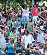 People enjoying the 10th Annual Gospel Music Festival on Sunday at Dogwood Dell. The free event was hosted by Sheilah Belle and Praise 104.7 FM as part of the City of Richmond’s Festival of Arts. (Sandra Sellars/Richmond Free Press)