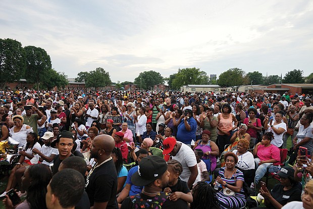 Hundreds of people gather in Norfolk’s Young Terrace public housing community Tuesday night to pay tribute to late boxing champion Pernell “Sweet Pea” Whitaker, who grew up in the neighborhood. Whitaker Lane, located about a block away from the vigil held on the grounds of P.B. Young Elementary School, had been named for the legendary boxer. Speakers included Norfolk Mayor Kenny Alexander, Norfolk Delegate Jay Jones and Virginia Beach City Councilman Aaron Rouse, a former NFL player.