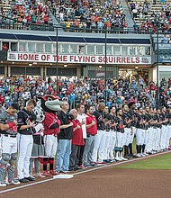 Top players from affiliates of Major League Baseball teams around the country pause for the Pledge of
Allegiance at The Diamond before last week’s All-Star Game.