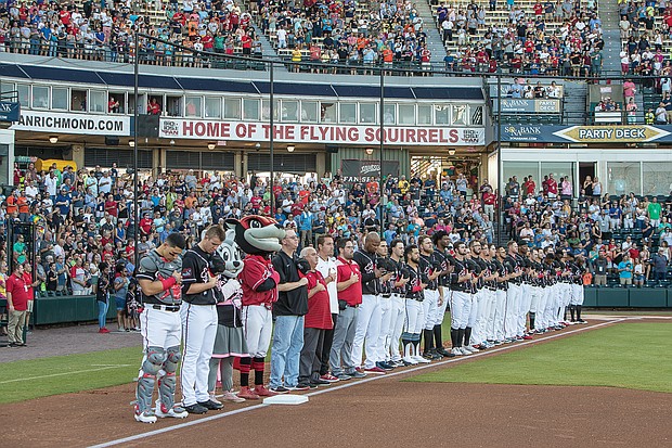 Top players from affiliates of Major League Baseball teams around the country pause for the Pledge of
Allegiance at The Diamond before last week’s All-Star Game.