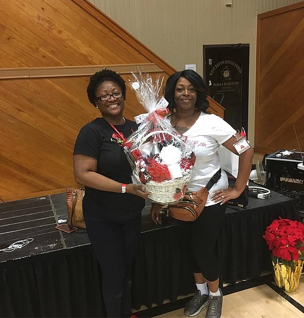 Left to Right:
Ms. Lockett, lucky winner of  the Le Bourriche basket giveaway & Trinette Wilson, Owner of Le Bourriche Bar & Gifts at The Holiday Marche’ 2018