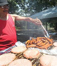 Black Pride RVA/
Sam Patterson, 62, handles the grill at last Saturday's Pride in the Park Tailgate Party, the final event of the 2nd Annual Black Pride RVA. The four-day festival was designed to promote the health and wellness of the black LGBTQ community through celebration, education and empowerment. (Regina H. Boone/Richmond Free Press)