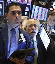 The Dow is set to open lower as investors are getting jittery ahead of the Federal Reserve's interest rate decision.