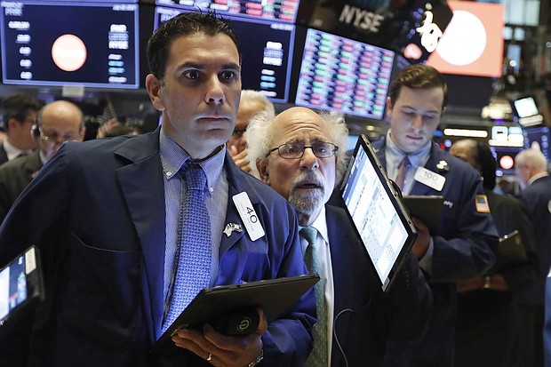 The Dow is set to open lower as investors are getting jittery ahead of the Federal Reserve's interest rate decision.