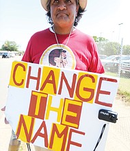 Stephen Rivera of Richmond carries his message on a sign outside the team’s training camp on West Leigh Street. He has picketed against the team’s racist name each year since the team began practicing in Richmond in 2013. He has no suggestion for a new name but says anything is fine “as long as it’s not something that denigrates native people or any of us.” A U.S. Supreme Court decision in June regarding “immoral” or “scandalous” trademarks may bolster the team’s legal efforts to keep its offensive, trademarked name.