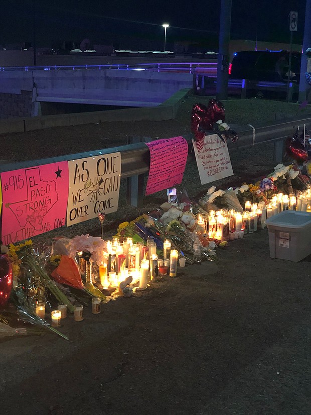Candles and signs in front of the Walmart in El Paso, Texas following a deadly shooting.