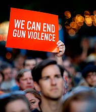 The same day that a gunman opened fire on an early-morning crowd in a Dayton, Ohio, nightlife district, residents attending a vigil for the victims of the shooting shouted at Gov. Mike DeWine to "do something."