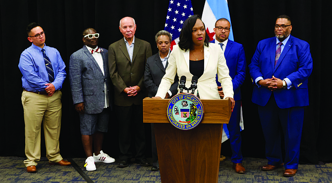 During a recent press conference, Chicago Public Schools CEO Janice Jackson (pictured at podium) announced that 10 schools would be added to the Opportunity Schools program for this upcoming school year. Photo Credit: Chicago Public Schools