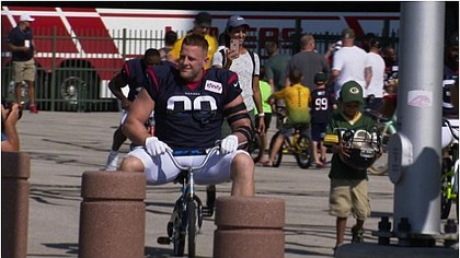 JJ Watt on a child's bike