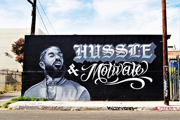 Hussle & Motivate was the motto of the slain rapper Nipsey Hussle, tribute mural near the end of LA’s Arts District on Violet Street near Mateo St. (photo via flickr.com)