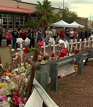 CNN Photojournalist Tom Larson captured touching moments when citizens of El Paso paid tribute to the victims of Saturday's shooting at a memorial set up near the shopping center where the shooting rampage took place.