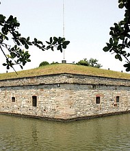 This June 11, 2008, file photo shows some of the fortifications inside the moat at Fort Monroe in Hampton. Casemate Museum historian W. Robert Kelly is working to 'humanize those enslaved' at Fort Monroe — one name at a time.