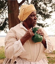 Interpreter Valarie Holmes portrays Angela, one of the first enslaved Africans to arrive in Virginia, at Historic Jamestowne.