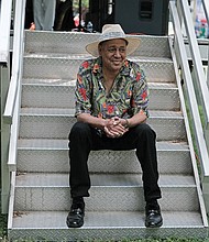 Music for the spirit/
Hundreds turned out for the 11th Annual St. Elizabeth Catholic Church Jazz & Food Festival, a fundraiser held last Saturday for the Highland Park parish and its various ministries. Location: The park beside the church on 2nd Avnue. Jazz pianist Debo Dabney, below right, waits on the stage stairs for his time to perform. (Sandra Sellars/Richmond Free Press)