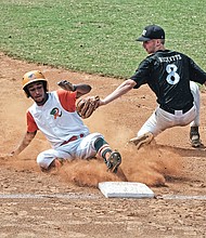 John Jimenez of the Baltimore Rattlers slides into third base as Stevie Ricketts of the Bowie Elite Black Sox tries to tag him out during the Metropolitan Junior Baseball League’s Inner City Classic U-16 championship game on Sunday at RF&P Park in Glen Allen.