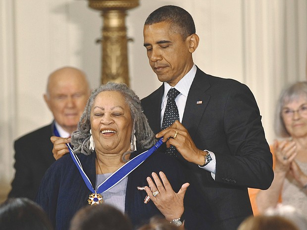 In 2012, President Obama awards a Presidential Medal of Freedom to prize-winning author Toni Morrison at the White House. The medal is the nation’s highest civilian honor.