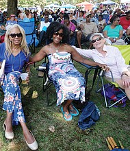 Music for the spirit. Hundreds turned out for the 11th Annual St. Elizabeth Catholic Church Jazz & Food Festival, a fundraiser held last Saturday for the Highland Park parish and its various ministries. Location: The park beside the church on 2nd Avenue. Friends, from left, S.R. Jeffers, Vanessa Raines and Diana Joaquin settle in to enjoy the sounds of local musicians, including the legendary Doc Branch and the Keynotes. (Sandra Sellars/Richmond Free Press)