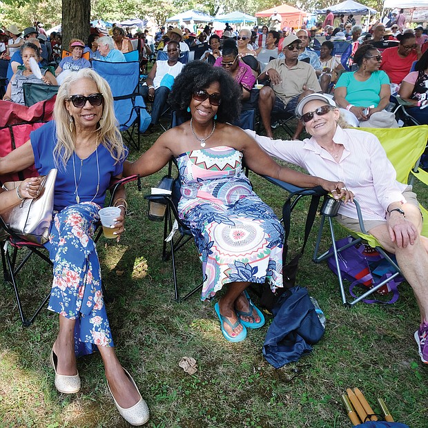 Music for the spirit. Hundreds turned out for the 11th Annual St. Elizabeth Catholic Church Jazz & Food Festival, a fundraiser held last Saturday for the Highland Park parish and its various ministries. Location: The park beside the church on 2nd Avenue. Friends, from left, S.R. Jeffers, Vanessa Raines and Diana Joaquin settle in to enjoy the sounds of local musicians, including the legendary Doc Branch and the Keynotes. (Sandra Sellars/Richmond Free Press)