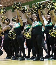 Huguenot’s alumni cheerleaders show off some moves during the cheering competition, which they won.