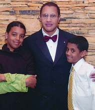 Dr. Carl Bell (middle) with his two children, Briatta (left) and William (right). Photo Credit: Provided by Tyra Taylor-Bell