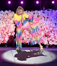 Taylor Swfit, shown here at a performance in June, is celebrating the celebration of her fun weekend. 

CREDIT: Kevin Winter/Getty Images for iHeartMedia